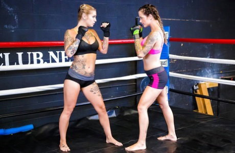 Female kick boxers settle their bout with lesbian sex in boxing ring