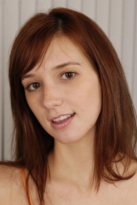 Girl next door type Katie doubles over backwards while showing her naked pussy