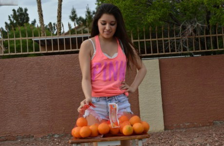 Amateur orange seller teasing a stranger with her sexy cleavage