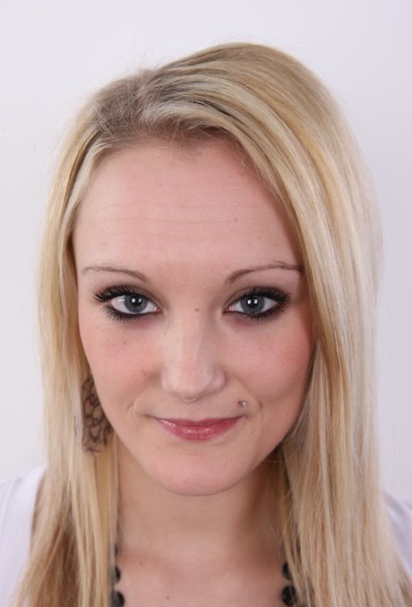 Blonde girl with a little bit of everything to spare gets completely naked