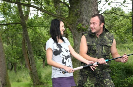 Brunette girlfriend gets a pussy cumshot fishing with her BF in the woods