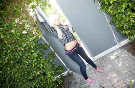 Amateur blonde Alexia Sky flaunts tiny tits & bubble butt in the garden nude