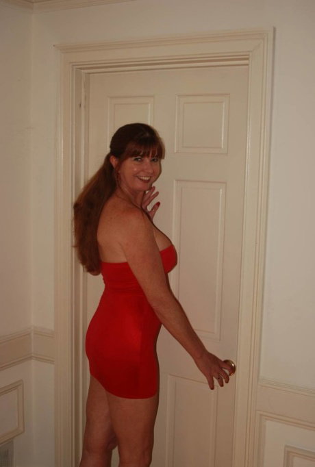 Mature secretary in a slutty red dress enjoying hot office sex with her boss