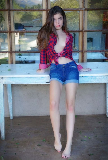 Leggy teen Leonella flaunts her nice ass after getting totally naked