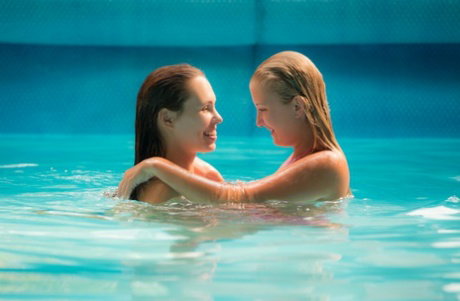 Teen lesbians Jenny Appach and her friend have sex in a small pool
