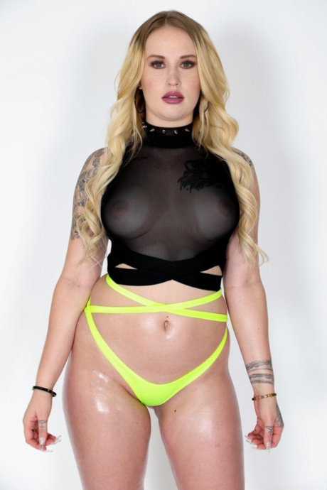 Sexy blonde Layla Love sports an oily sheen before nasty anal sex begins