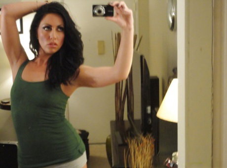 Solo girl Tiffany Brookes unveiling small breasts while taking selfies