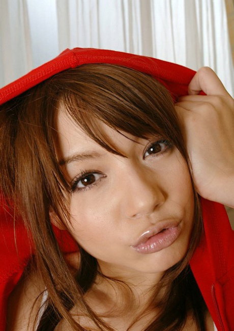 Japanese teen Tina Yuzuki hugs her stuffed animal after getting bare naked