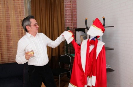 Young student Galia has sex with her teacher while he wears a Santa suit