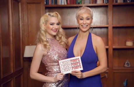 Blonde slut Kenna James poses with a female fan in a sparkly dress