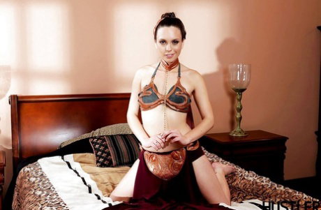 Solo model Jade Nile appears with slave collar and leash around neck