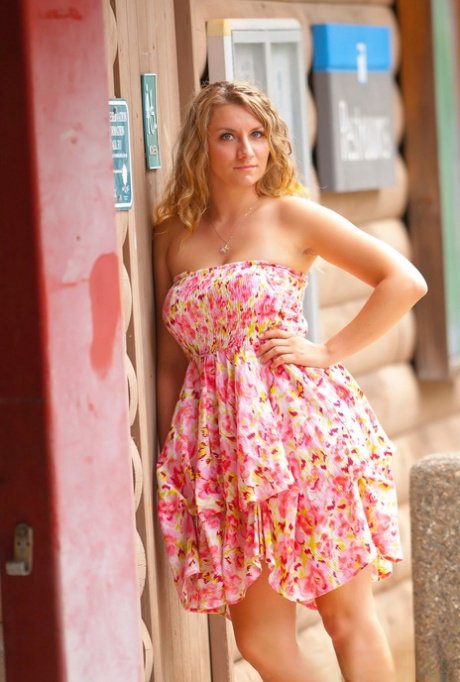 Chubby beauty Roxie lifts her summer dress to flash naked upskirt outdoors
