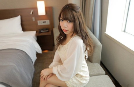 Japanese beauty Rino Serino strips to her pretties before getting atop a guy