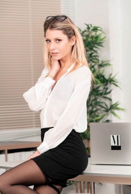 Blonde secretary Rebecca Volppetti seduces her boss while underneath his desk