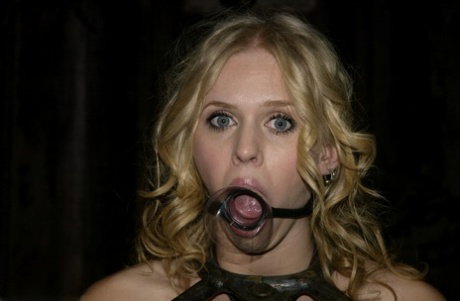 Pretty gagged blonde with pierced nipples gets her nipples & toes tied up
