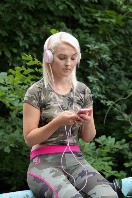 Platinum blonde Czech Lovita Fate strips her sportswear & masturbates outside