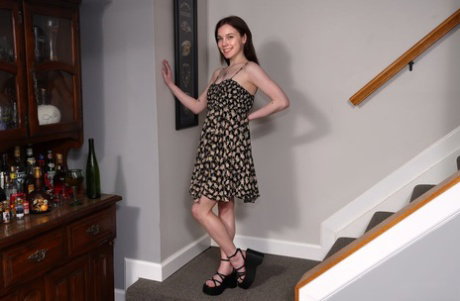 Brunette teen Venus Vixen pees on the lawn after modelling in the nude