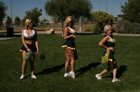 Busty blonde cheerleader Shyla Stylez enjoys rough classroom MMF threesome