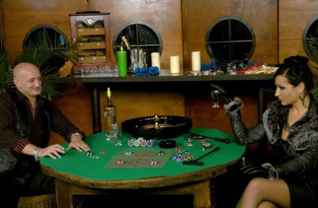 Gambling femdom Gina Killmer whips the naked loser & binds his cock and balls