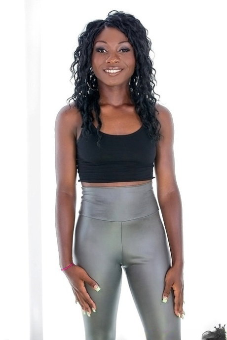 Ebony sugar in silver leggings undressing and exposing her ass