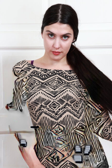 Young brunette with long hair flaunts her vagina after getting bare naked