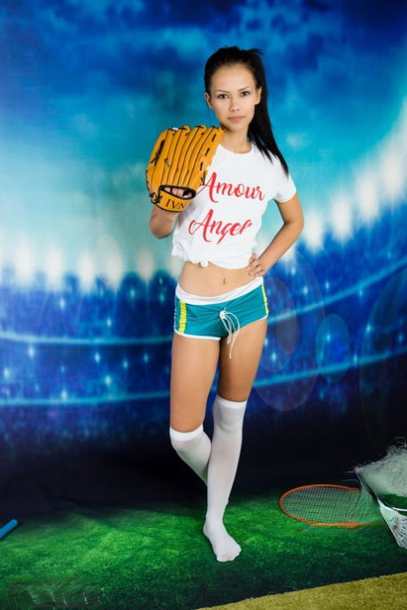Teenage sweetie with perky tits Lada announces a baseball game by stripping