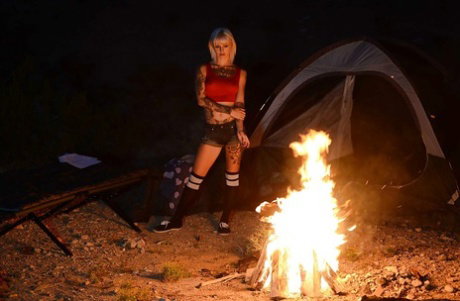 Outdoor posing of a big tits babe in shorts and socks Kleio Valentien