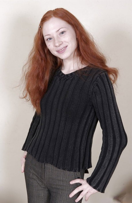 Skinny redhead teen with perky titties undressing and spreading her legs