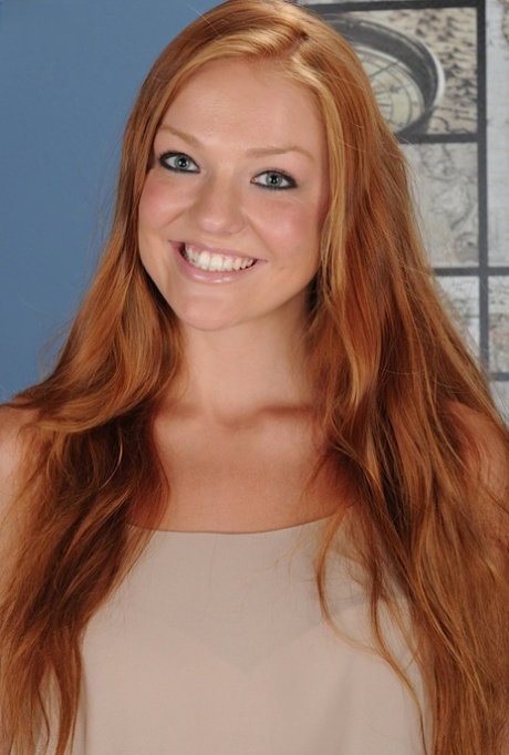 Cute redhead Farrah Flower parts her teen pussy after getting undressed