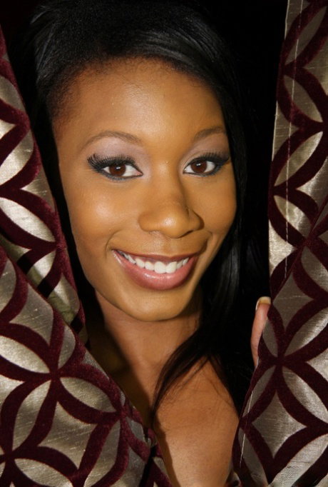 Ebony Rane Revere satisfies white dick through the hole in the red wall