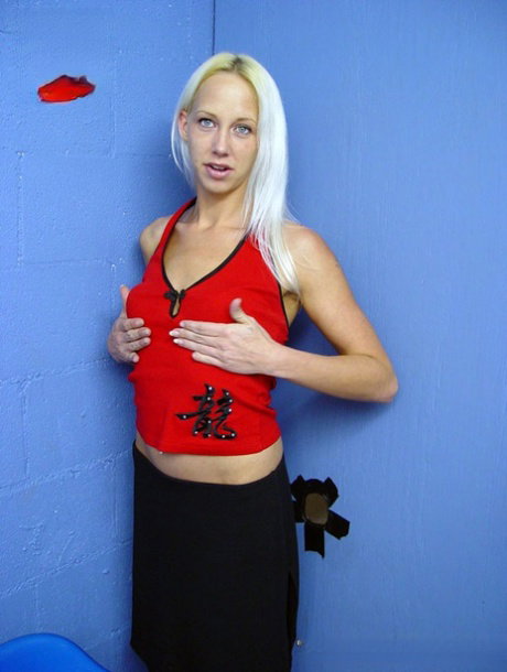Blonde teen Samantha gives a black cock oral sex via a gloryhole