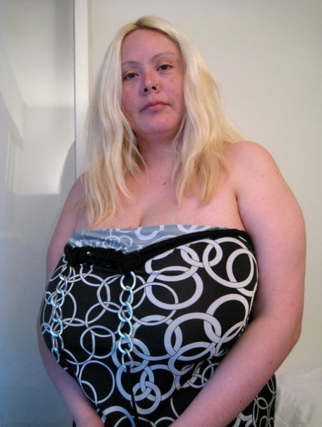 Chubby blonde Dalila lets out her magnificent breasts and flaunts them