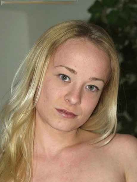 Blonde girl Eliza uncovers her tiny tits before playing with her tight slit