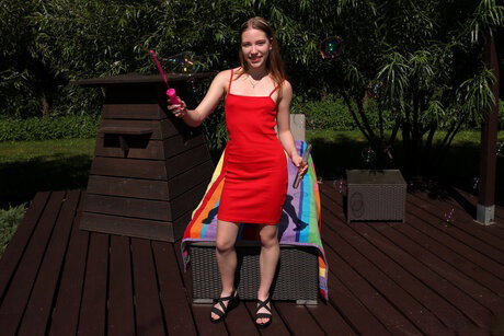 Skinny teen Maya Sin masturbates on a deck chair while totally naked