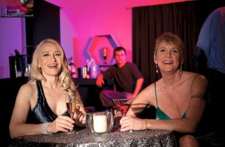 Horny mature Robin Pachino picks up a couple at a bar for hot groupsex