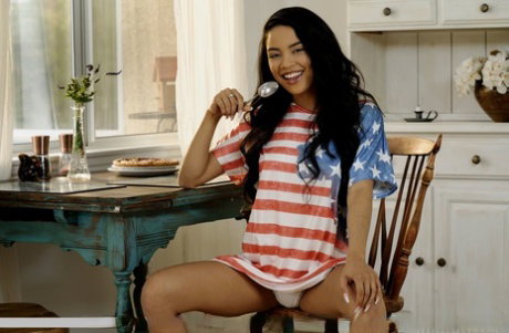 Sweet Latina teen Maya Bijou makes a skullcap out of a T-shirt after disrobing