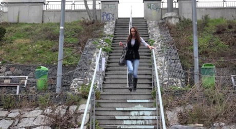 Cynthia Vellons pulls down faded jeans to piss on public steps