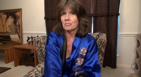 Horny grandmother gets naked while wearing heels in order to masturbate