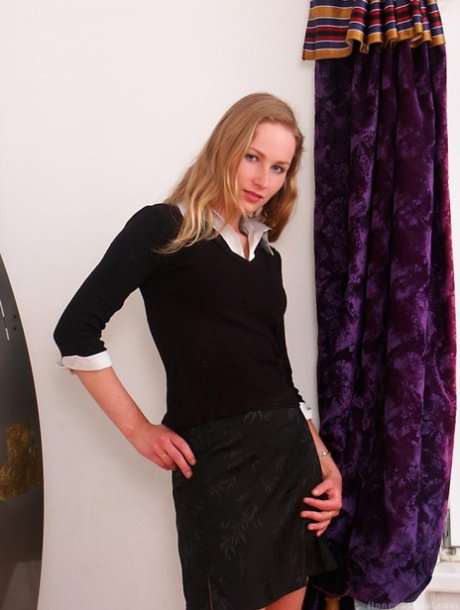 Petite pornstar Radka Daryn does a hot striptease wearing high heels