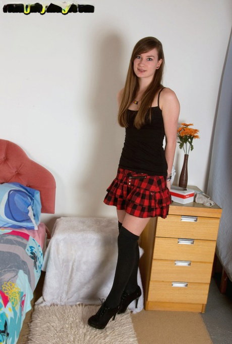 Teen amateur Emily Jane shows off tiny tits in hooker socks and plaid skirt