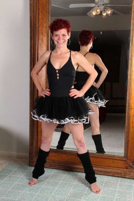 Mature redhead ballerina Suzy Stanton strips and masturbates on the floor