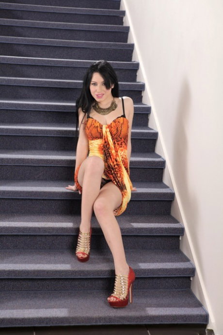 Sexy Italian babe Luna Ora works out her pussy with a speculum on the stairs