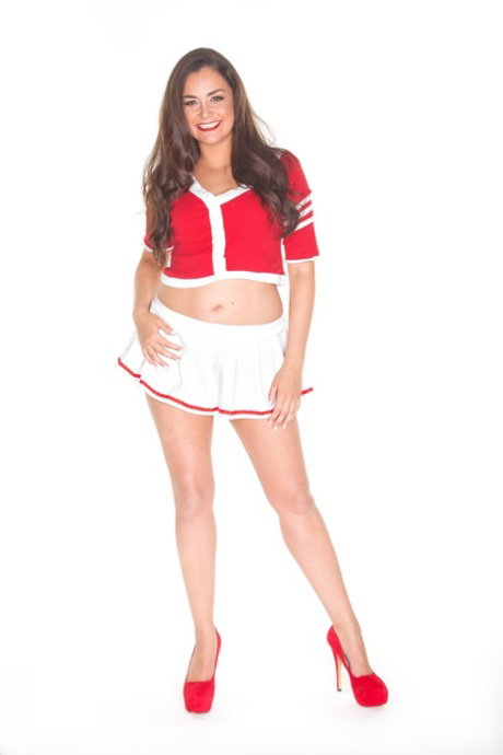 Petite Latina model Allie Haze exposes her phat ass as she strips in red heels