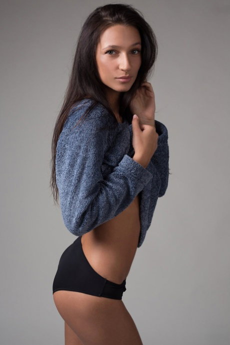Attractive brunette Kenya strips to pose her perfect body naked on her knees