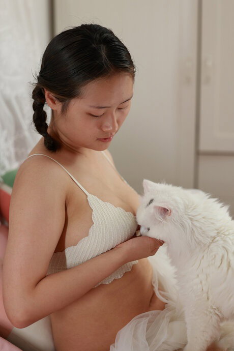 Chinese beauty Sang Wei teases with her big tits & ass in a solo
