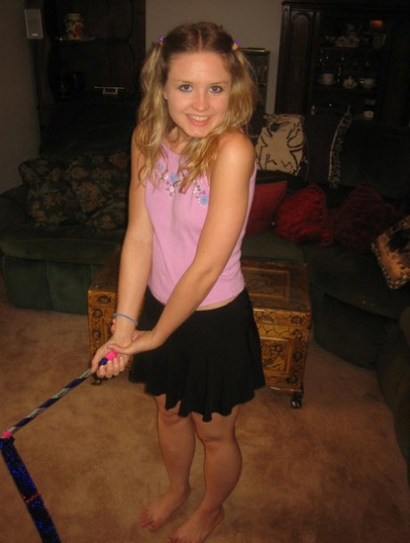blonde teen amateur Kitty doffs her clothes and poses naked at her home