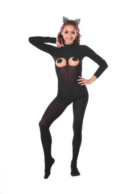 Redheaded Latina female toys her asshole after removing a bodystocking