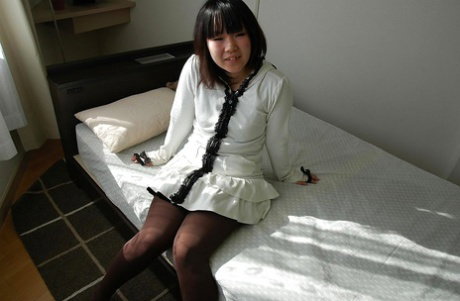 Asian teen Chihiro Tanabe undressing and spreading her pussy lips in close up