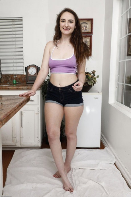 Adorable amateur babe Luci Lovett loses her shorts and teases with her bush