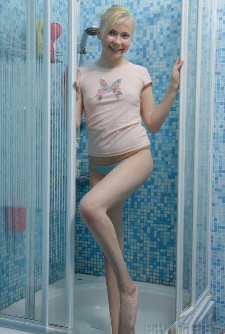 18-year-old blonde Bunny S masturbates with a vibrator in the shower